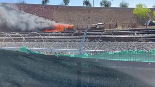 Fire burns at homeless camp along railroad tracks in downtown Las Vegas