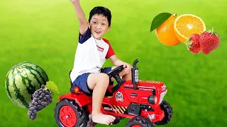 Yejun and useful work with toy tractor on power wheels