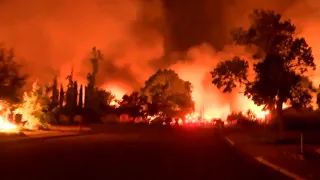 Residents flee Carr Fire as it tears through Redding