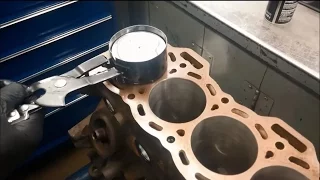 Installing a piston into a cylinder