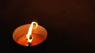 Outdoor candle in the dark - super slow motion