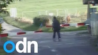 Caught on camera: People dice with death in level crossing near misses