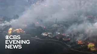 Raging wildfire destroys homes in Southern California