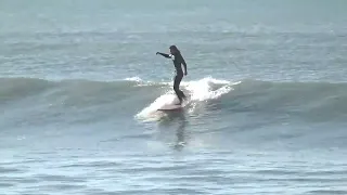 Surfing at Sumner Beach, Christchurch, New Zealand.