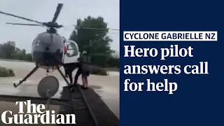 Cyclone Gabrielle: helicopter pilot balances on roof in 'daring' New Zealand rescue