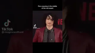 Finn wolfhard sneezing in the middle of red carpet