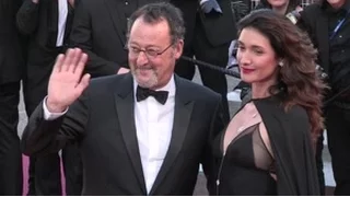 Jean Reno and his wife on the red carpet for the Premiere of The Last Face in Cannes