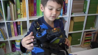 4 year old unboxes remote control Batbot toy