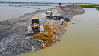 Special Action Showing Bulldozer , Dump Truck Push , Moving Rock into Water Building  Road on Lake