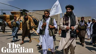 Taliban celebrate and inspect destroyed US planes after last US troops withdraw