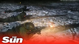 Russia's newly-enlisted soldiers fire rifles at night in stealth exercises