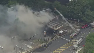 Crews battle large fire at Atlanta gas station off I-75 | Aerials