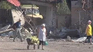 Ukraine: Slovyansk residents return to homes and businesses in ruins