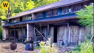 Two brothers have renovated and cut the grass in a abandoned wooden house for many years