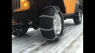 Jeep Rubicon with tire chains vs steep snow covered hill