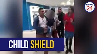 WATCH: Father uses own son as shield during alleged theft