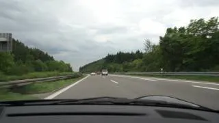 German girl on Autobahn in Porsche 200 kph