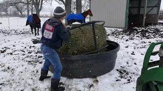 Chris netting a round bale