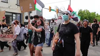 Protesters march in Richmond to deliver a message to Sen. Tim Kaine