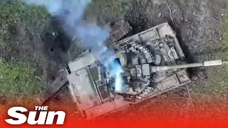 Ukrainian drones drop bombs and blow Russian tank to pieces
