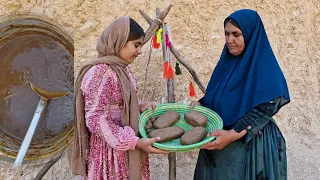 Preparation of delicious Qaraqrout by a nomadic mother and daughter