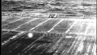 US F6F Hellcat Fighter plane approaches and drops a message on the deck of USS Ha...HD Stock Footage