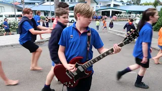 Young school student plays AC/DC Thunderstruck during interval! Watch the students reactions!!