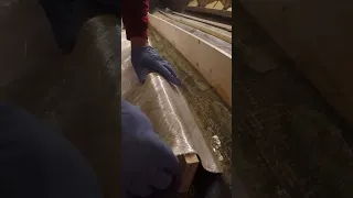 Wrapping boat stringers with fiberglass mat