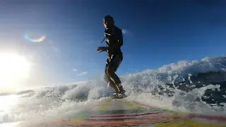 Surfing at White Plains Beach, Oahu, Hawaii
