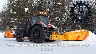 Snow clearing - Valtra T254 Cutting snowbanks with a sideplow ,clear Streets winter 2021