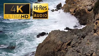 Relaxing 4k video with high-quality sound in which ocean waves crash against sharp rocks (No music)