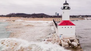 40+MPH Winds Hitting Michigan City Lighthouse Huge Ice Balls Breaking Up Shelf Ice 4K Drone Footage