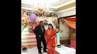 couple dance on occasion of "golden jubilee ceremony of parents in laws"