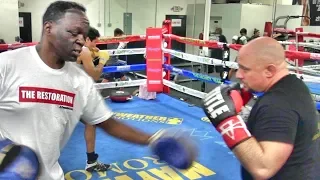 Jeff Mayweather holding pads for his accountant