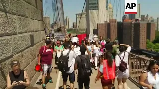 Anti-Trump immigration demo crossing Brooklyn Bridge in New York