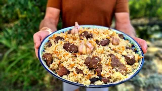 UZBEK PLOV from mutton in a cauldron.