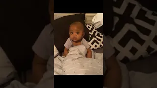 Dad sneaks in and startles baby boy as he's falling asleep.