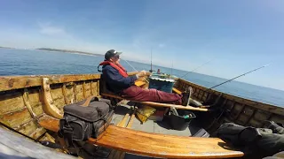 Fishing for Big Eels from a Wooden Boat