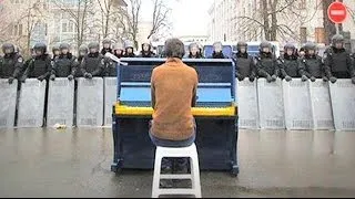 Playing the piano to riot police in Ukraine - #BBCTrending - BBC News