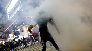 Hong Kong protesters clash with police, throw Chinese flag into harbour