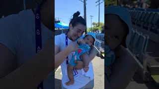 Ons Jabeur teasing Aryna Sabalenka with the baby of their shared Performance Analyst