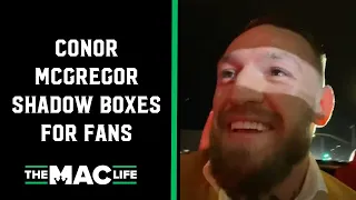 Conor McGregor shadow boxes for rabid fans; surrounded after dinner