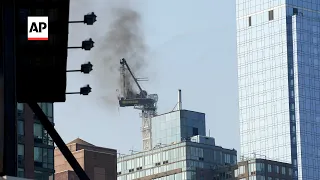 New York City crane's arm burns, collapses to street