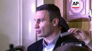 Opposition leader Klitschko and protesters react after PM resigns and govt offers more concessions