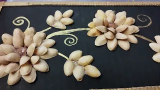 DIY Pistachio shell flowers wall hanging. #pistashellcraftideas #pistashellflowers #pistashellart