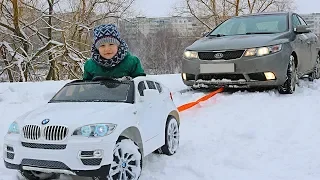 FUNNY BABY Stuck in the SNOW! Kid Pretend Play ride on POWER WHEEL Towing car BMW video for kids