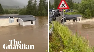 Storm Hans: moment mobile home dragged away by floodwater in Norway