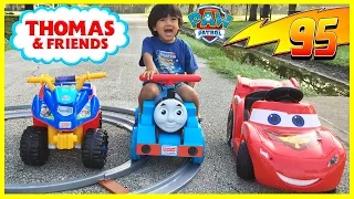 Ryan riding Disney Cars Lightning McQueen and Paw Patrol Power Wheels