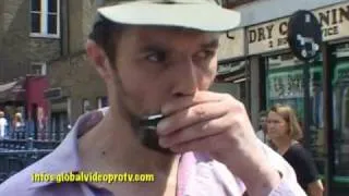 STREET MUSICIAN PLAYS HARMONICA, LONDON