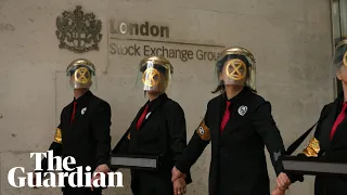 Extinction Rebellion activists glue themselves to London Stock Exchange in fresh protest